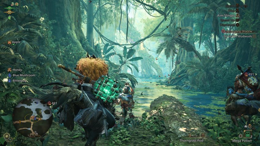 Karakter Monster Hunter World melawan monster Rathalos di area hutan