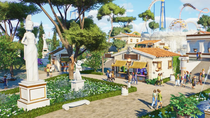 Planet Coaster 2 menampilkan taman hiburan modern dengan roller coaster spektakuler dan area water park yang realistis